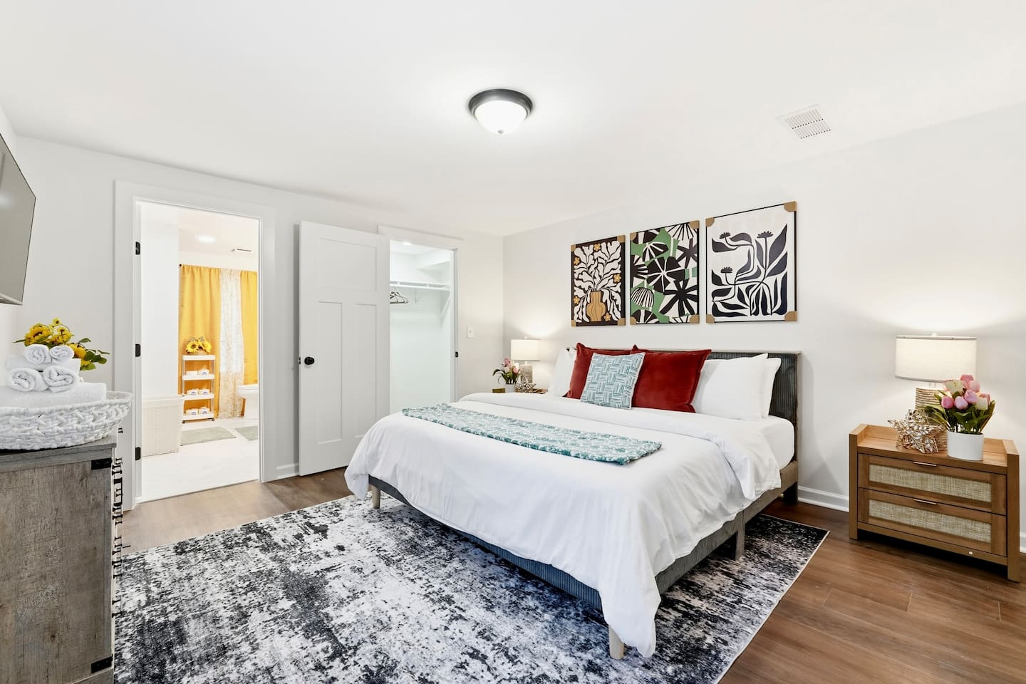 Finally, the basement bedroom features a beautiful, cool-toned color scheme with natural accents, a king bed, and a Roku-powered Smart TV. This room includes 2 full-body towels, 2 washcloths, and 2 hand towels for your stay.
