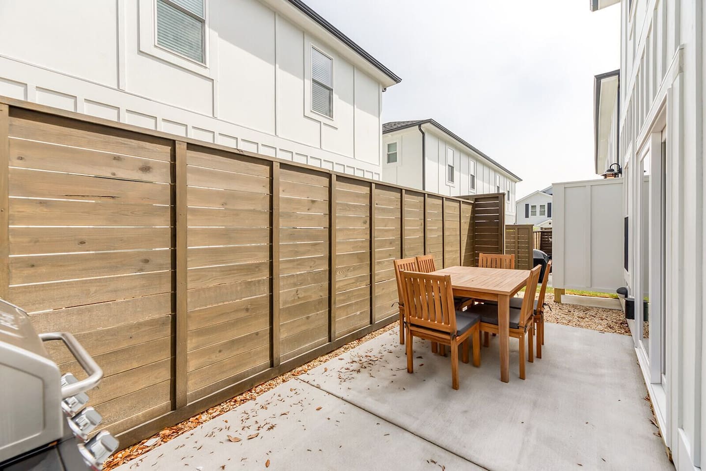 Enjoy outdoor meals and relaxing evenings in the fenced patio space.