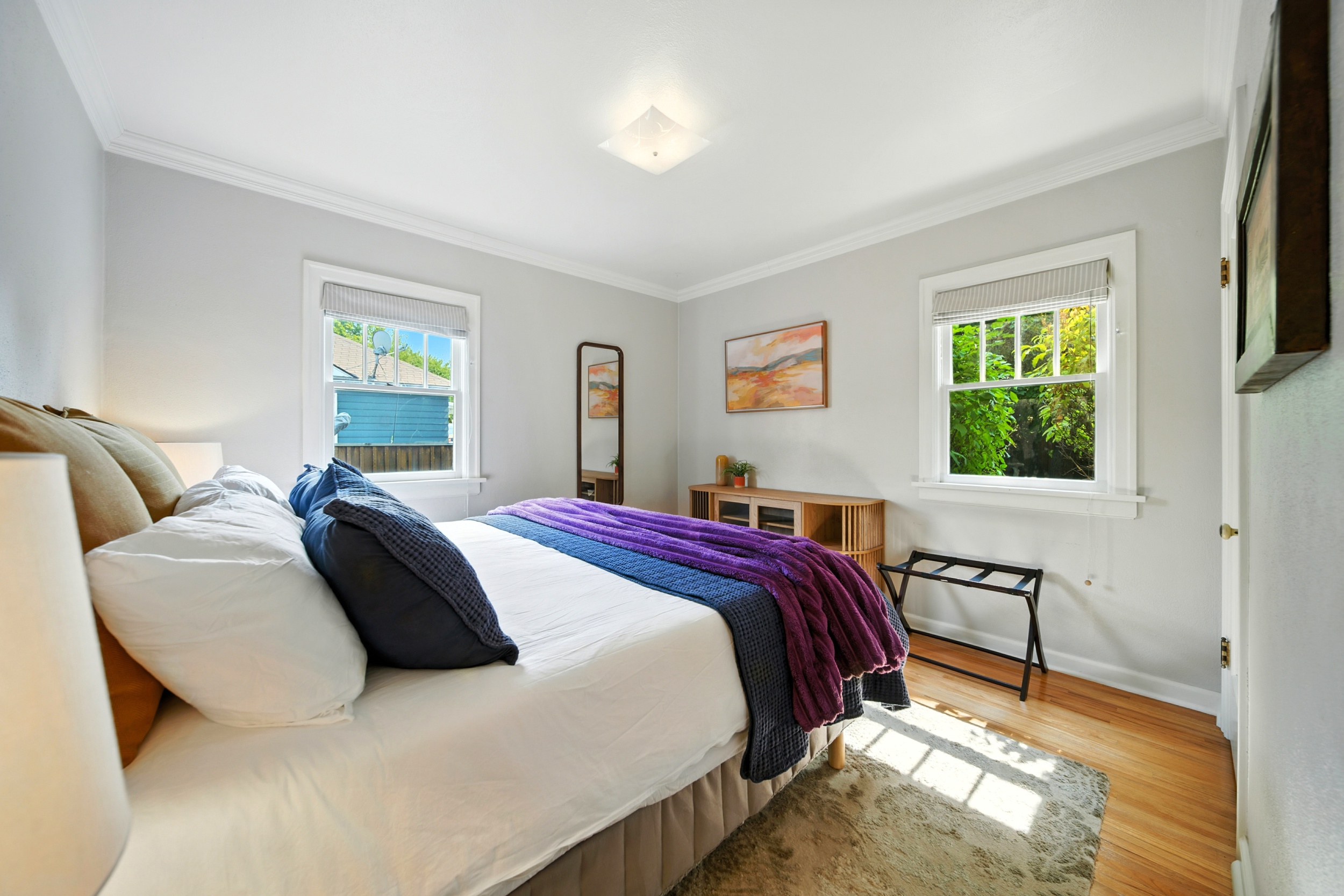 Bedroom #1 of 3: King bed with backyard views