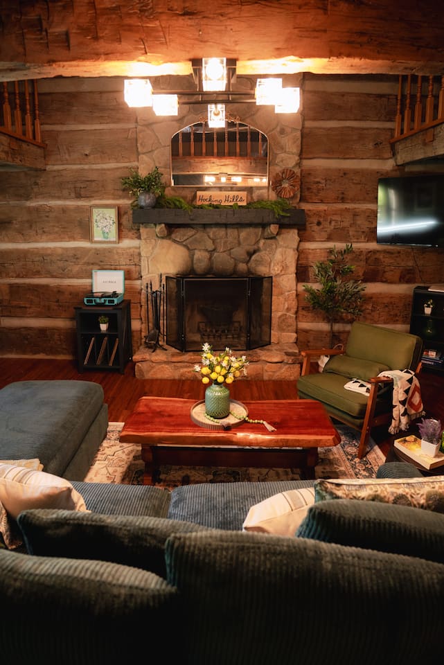 Snuggle up by the stone fireplace, creating the perfect cozy atmosphere