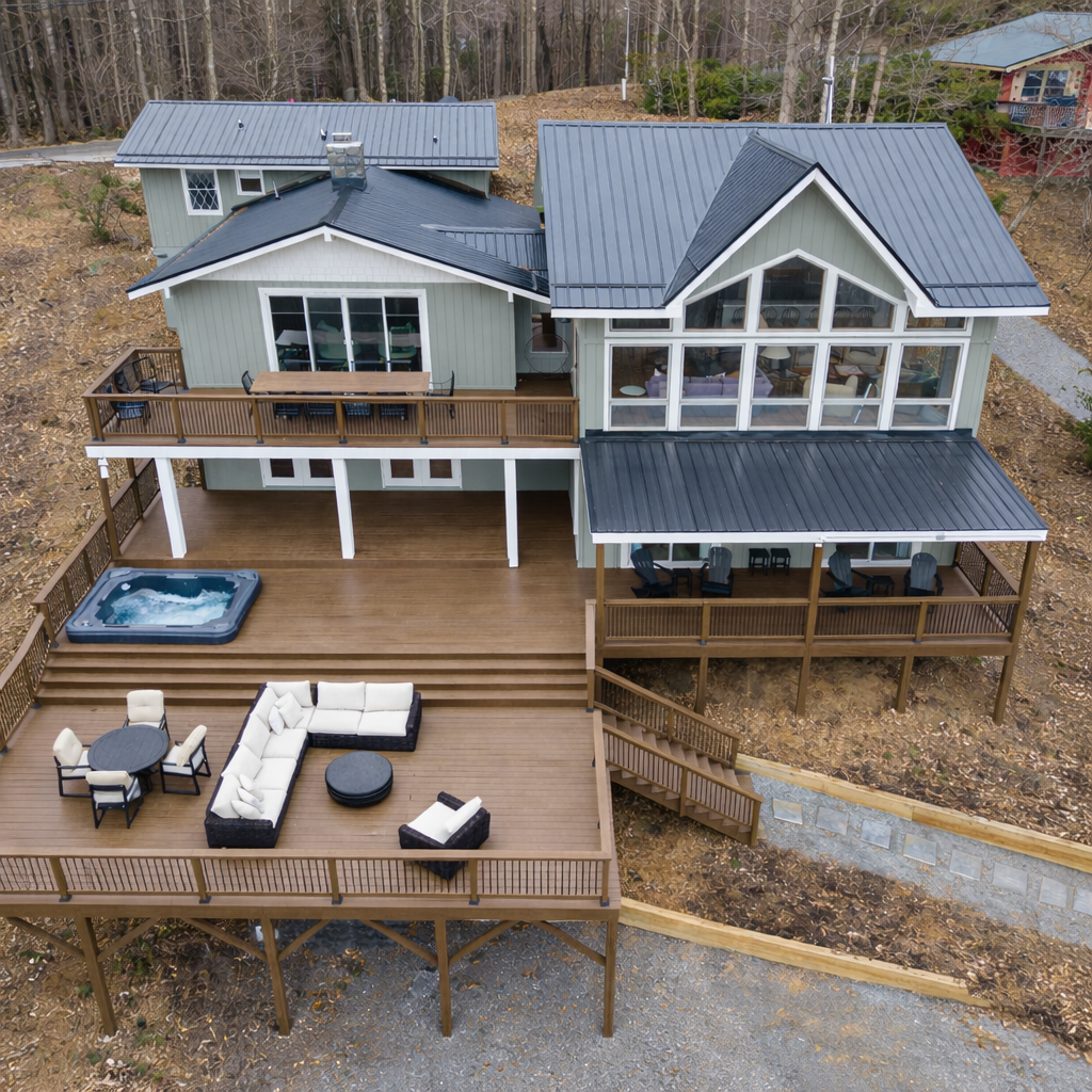 The expansive back deck—larger than the footprint of the home—offers multiple seating and gathering areas with uninterrupted views in every direction.