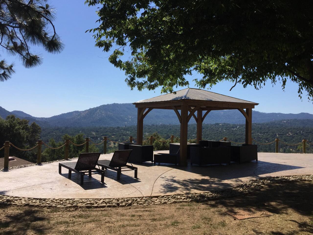 Gazebo with patio furniture and propane fire pit