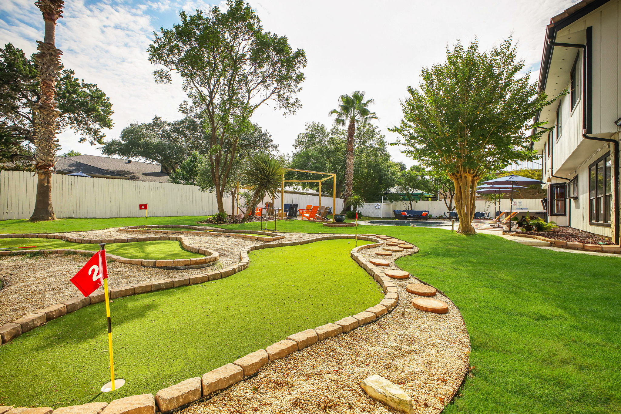 Mini Golf: Challenge friends and family on the custom backyard mini-golf course.