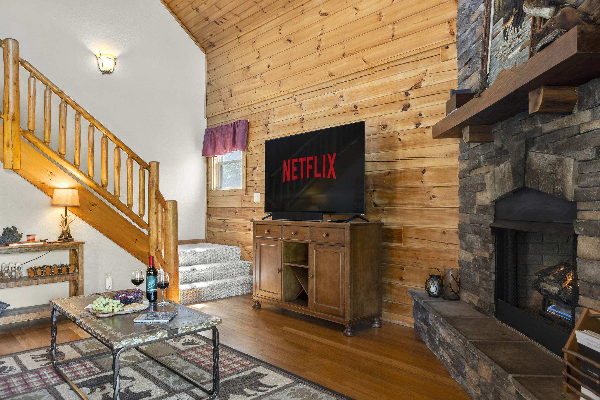 Living Room: Unwind with Netflix by the stone fireplace and enjoy mountain views from the windows!

