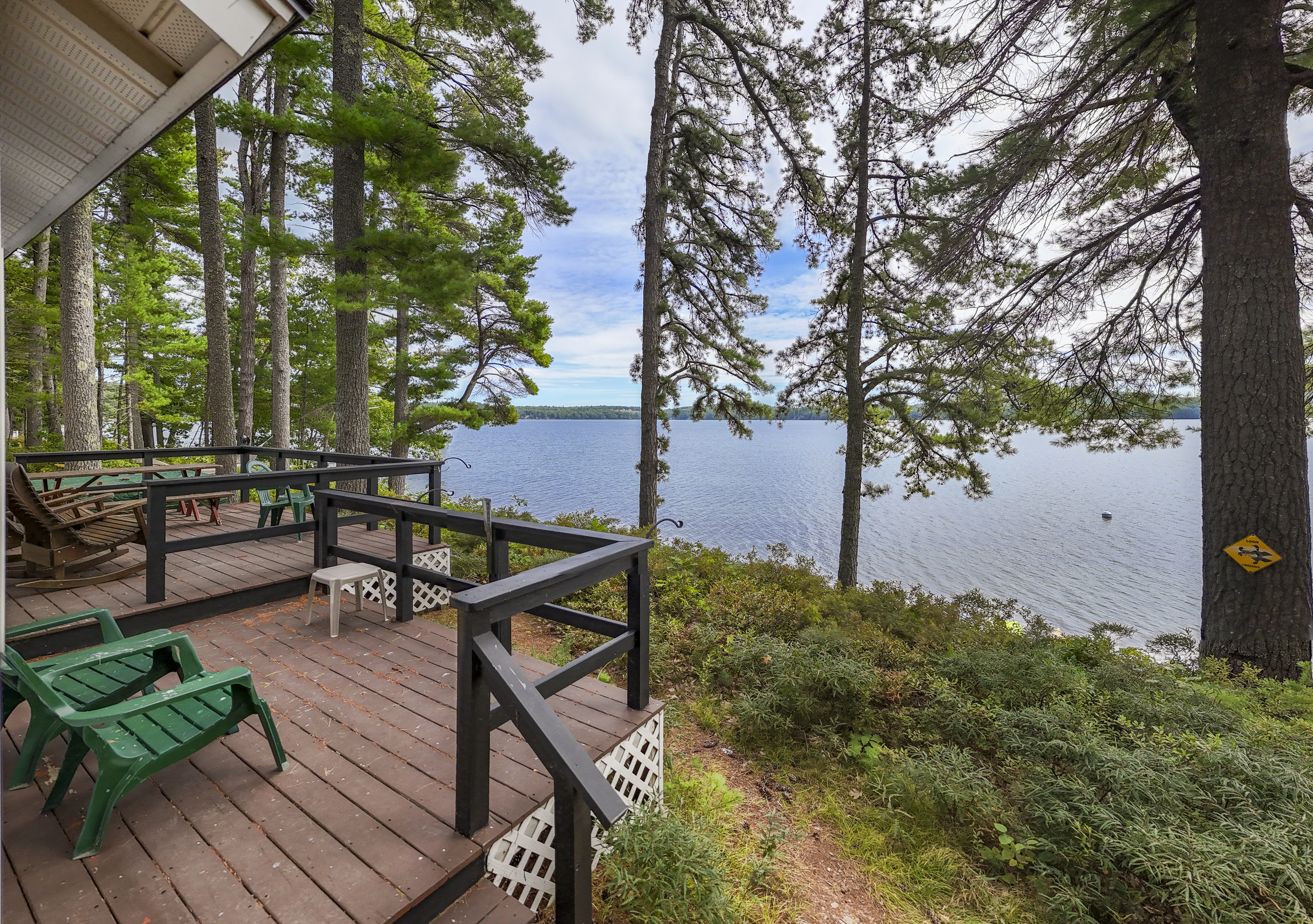 This uncovered deck in front of the attached private residence is available for guests to enjoy, offering another spot to sit and watch the lake. The residence itself is private and not included in your stay.
