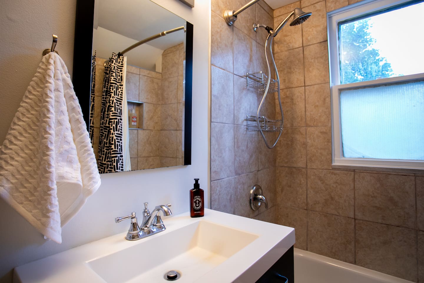 Clean, modern finishes with a deep vanity, generous mirror, and bright lighting — designed to make everyday routines easy and comfortable.