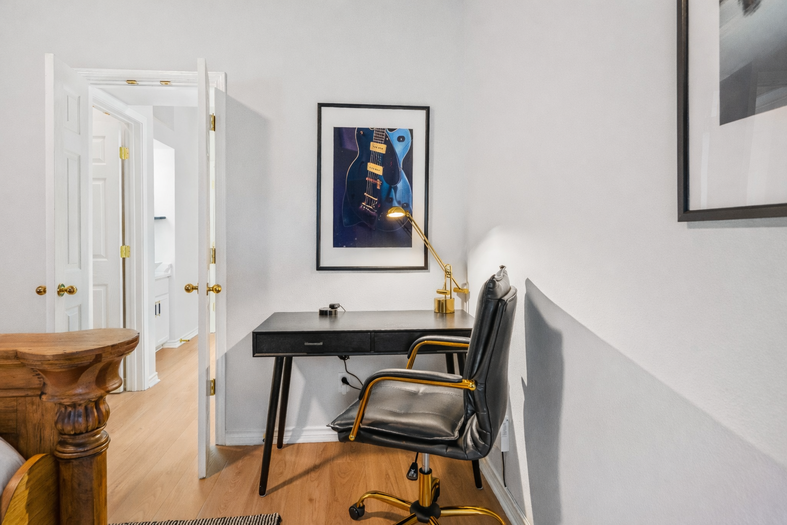 Private workspace with sleek desk, comfortable seating, and focused lighting. Designed for remote work, video calls, or staying productive during your Austin stay.