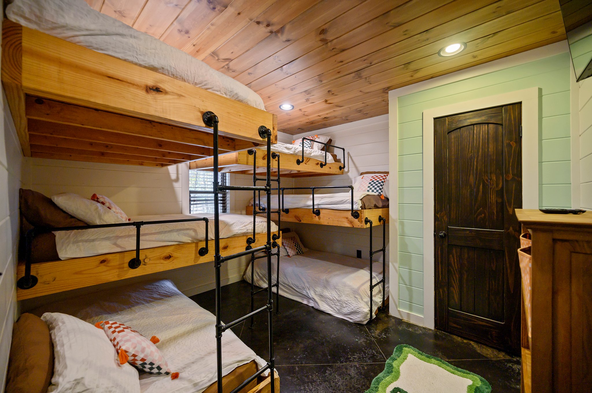 Disco Cowboy | Bunk room with six individual twin bunks (sleeps 6). With two king beds, this cabin sleeps up to 10.