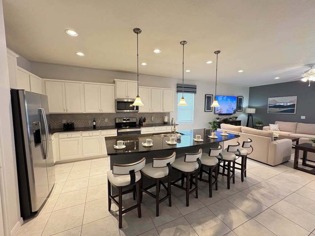 Open concept kitchen/dining/living room ensures everyone is part of the fun