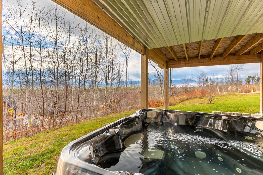 Your cozy mountain escape comes complete with a private hot tub!