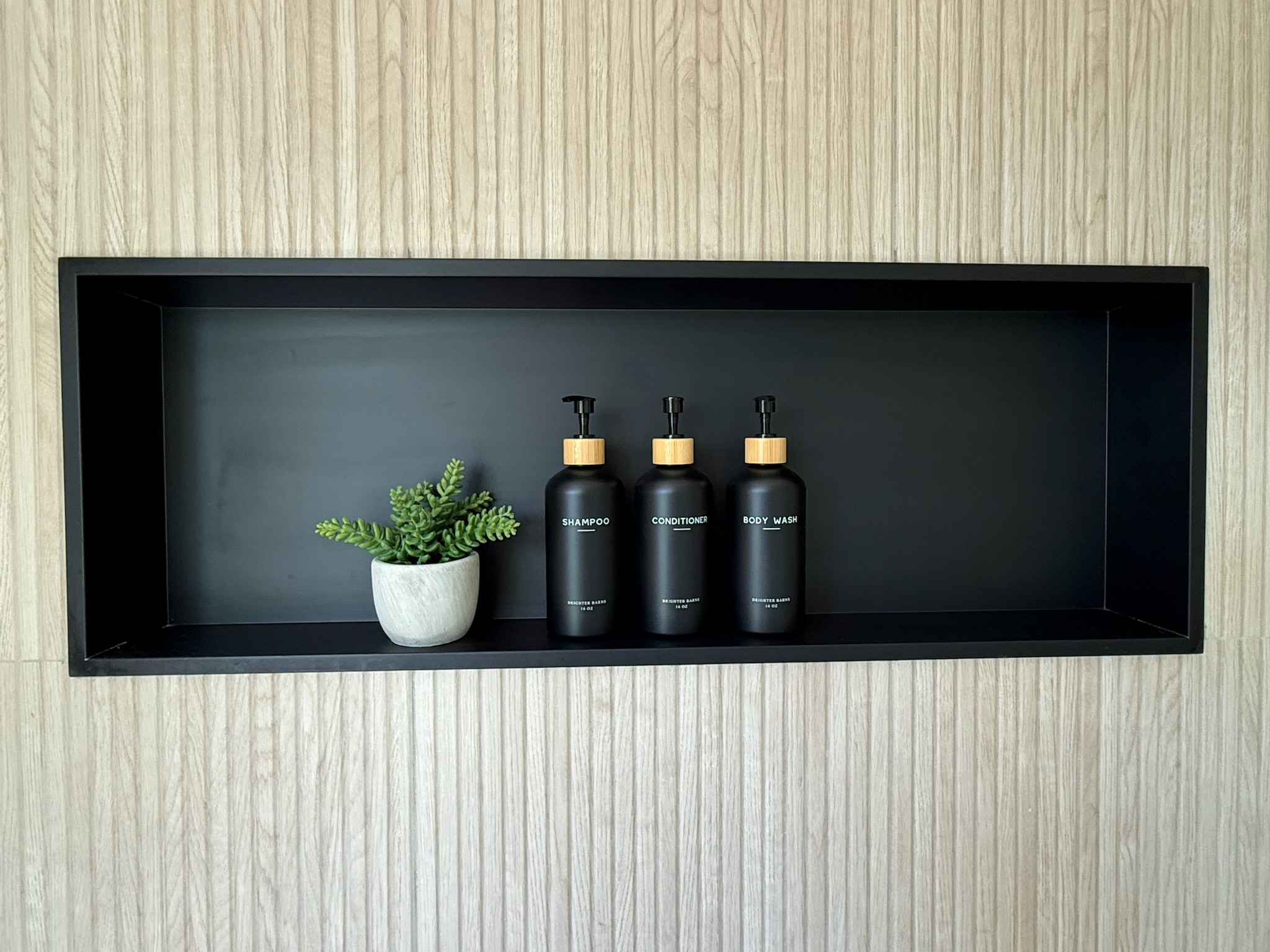 Large modern niche in the main level master en suite. Shampoo, conditioner and body wash provided in each shower