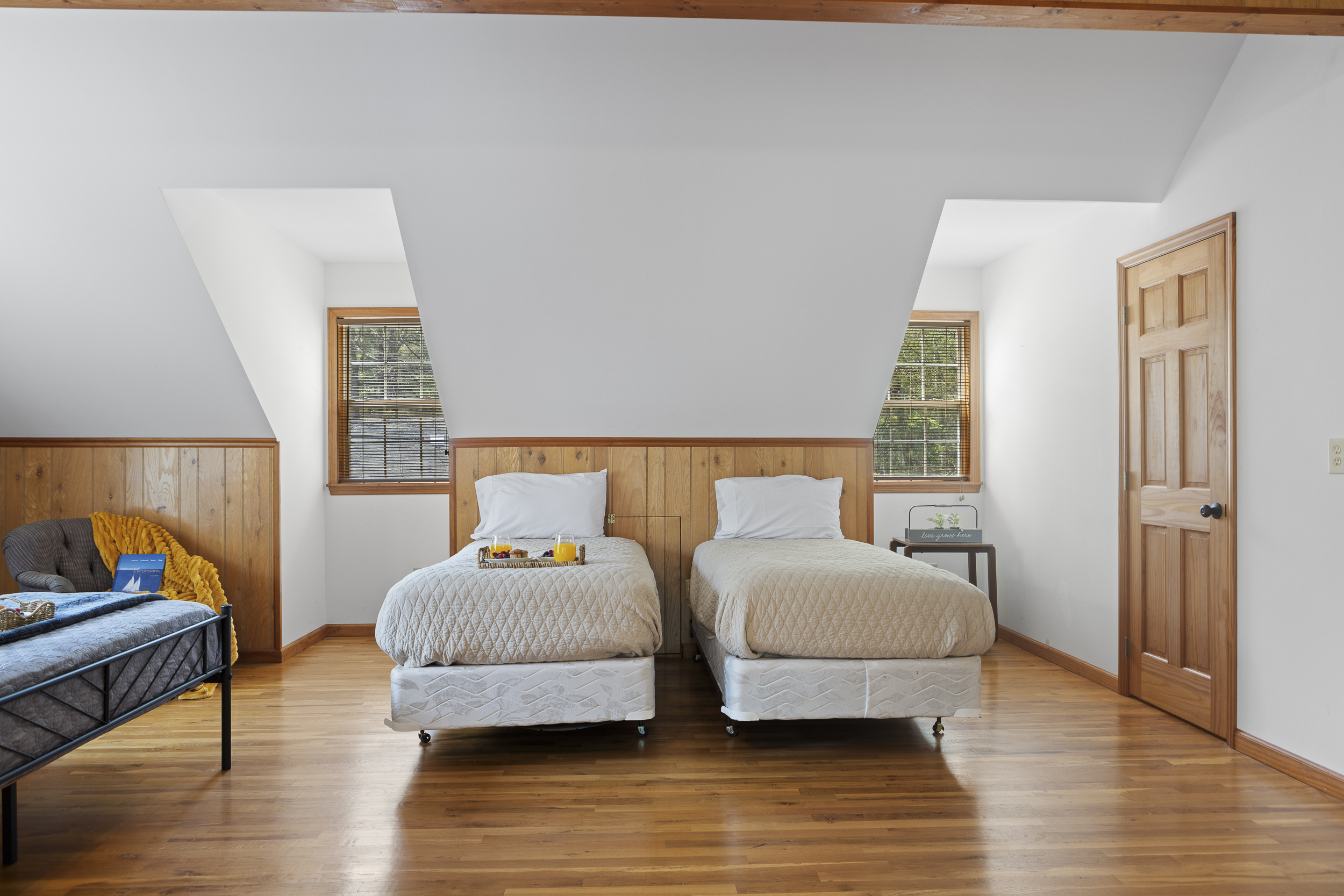 Queen Bedroom 3: Bright and airy retreat with twin beds and rustic charm—perfect for unwinding!