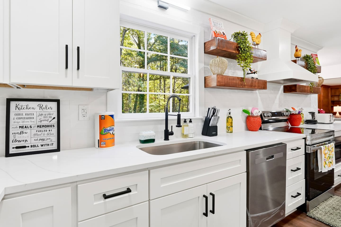 Beautiful white kitchen fully equipped with all the appliances and essentials of a home away from home.