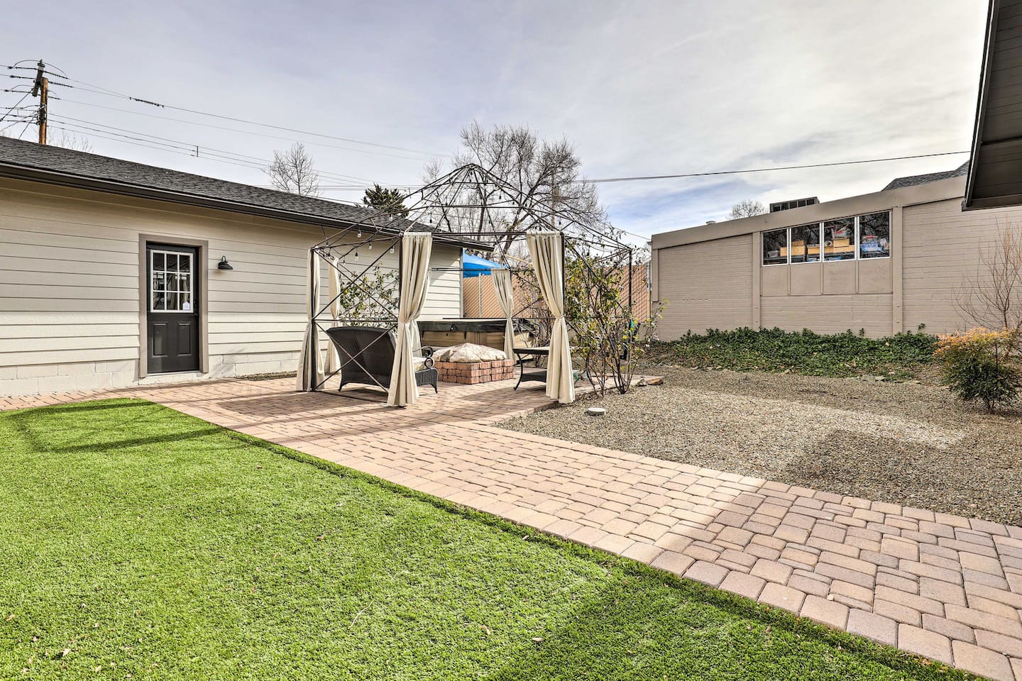 A green lawn and private gazebo set the stage for lazy afternoons outdoors.