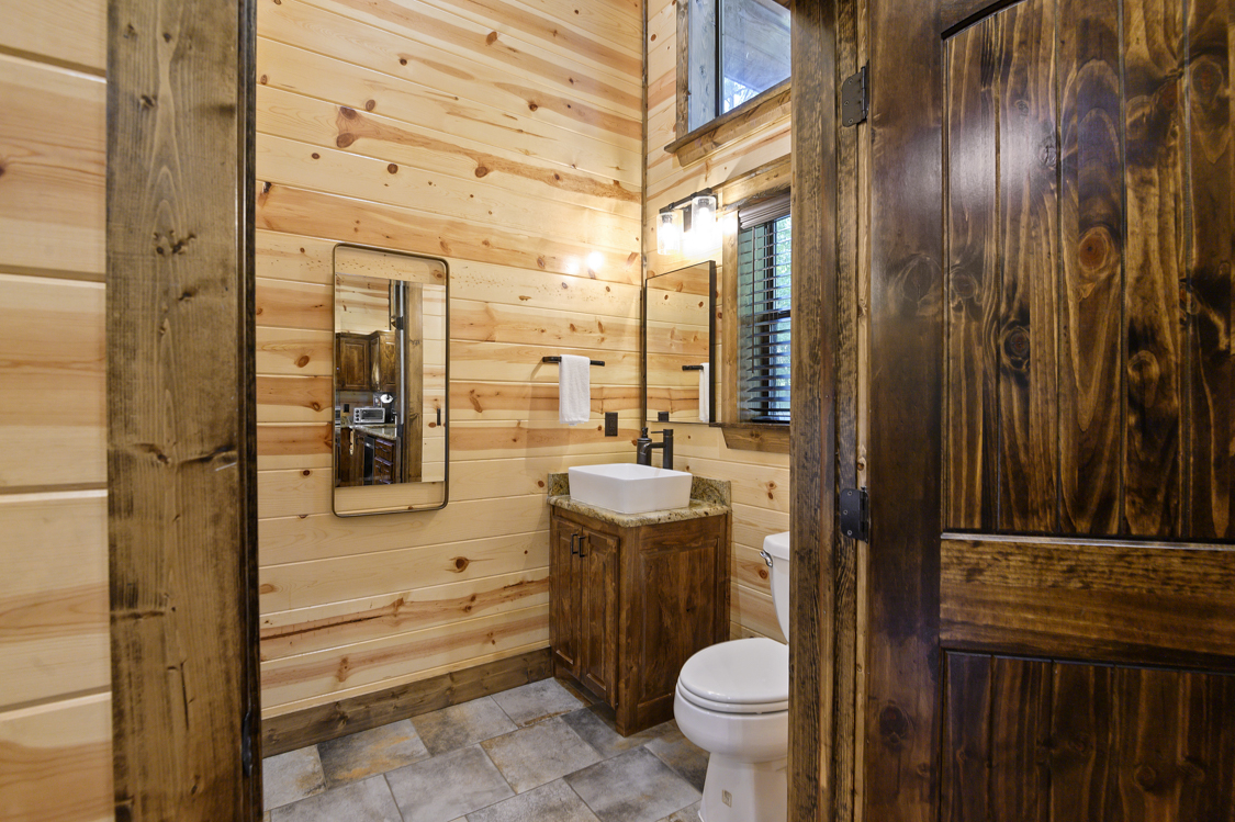 Half bath located off kitchen with full size washer and dryer.