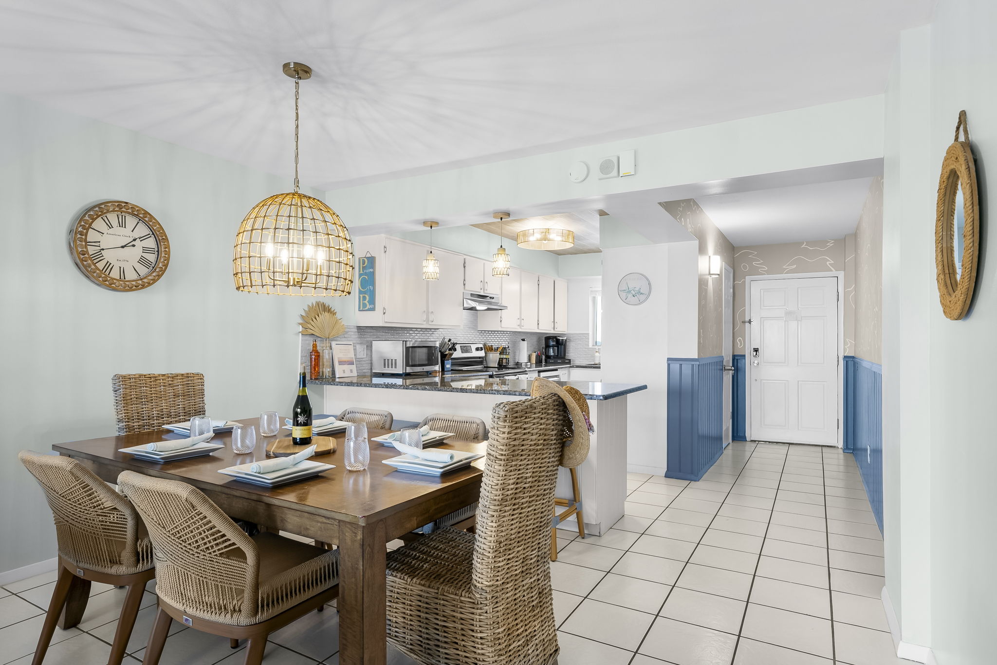 The dining area offers new chairs, cups, plates, outdoor dinnerware, and all the essentials you'll need to gather around the table together .