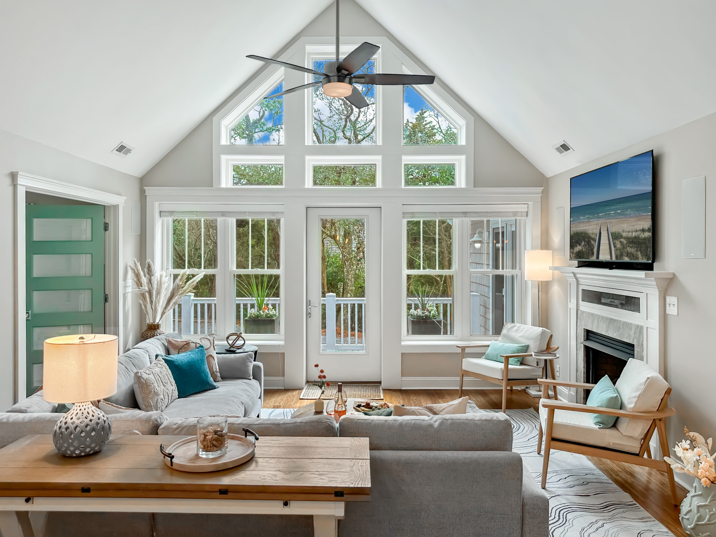 A stunning cathedral ceiling, a light and airy living room...