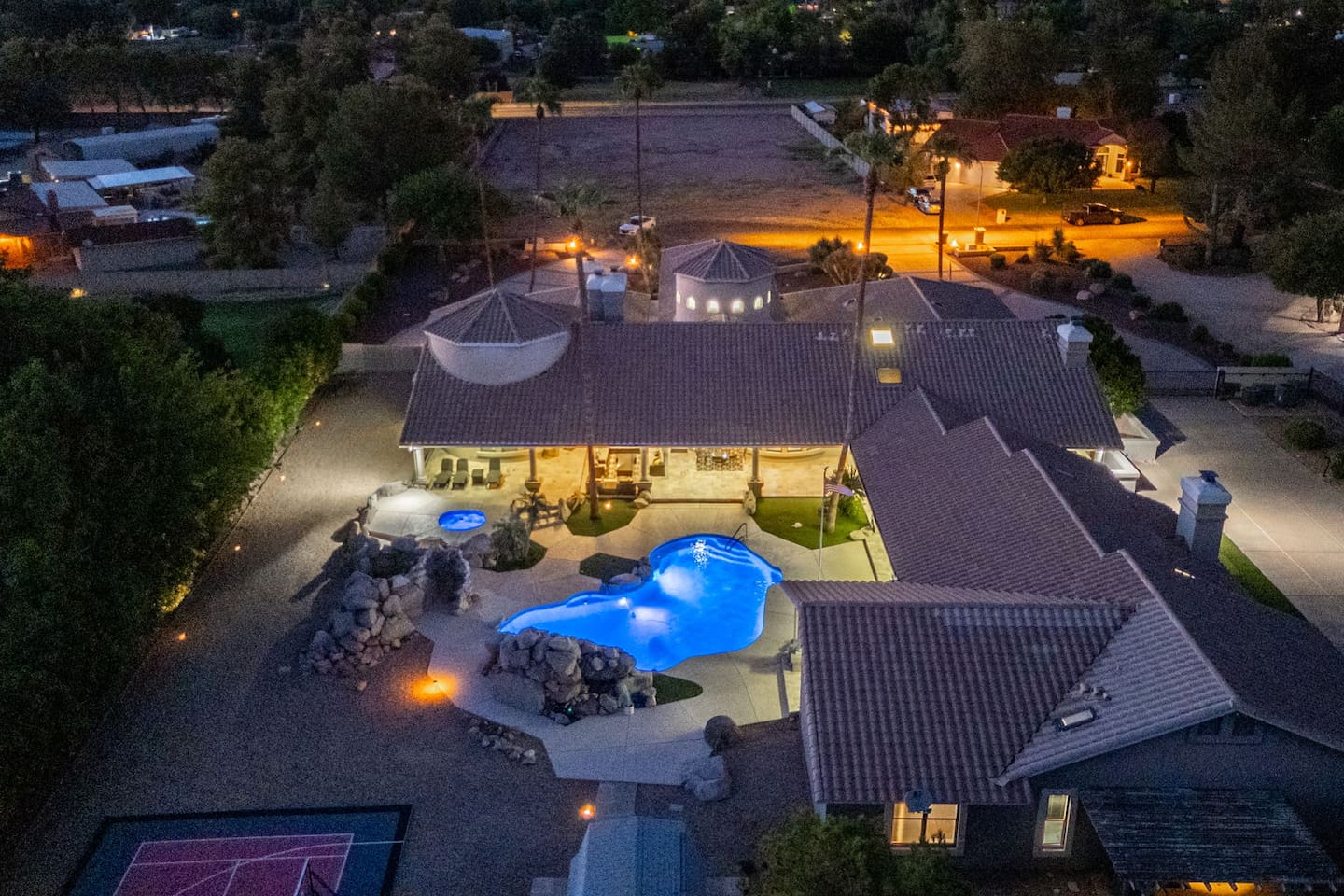 Experience true luxury with this stunning nighttime view showcasing spacious outdoor seating, ambient lighting, and the warm glow of your private escape.

