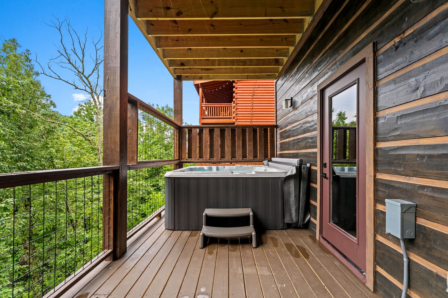 downstairs hot tub with smoky mountain views and privacy fence from neighbors 