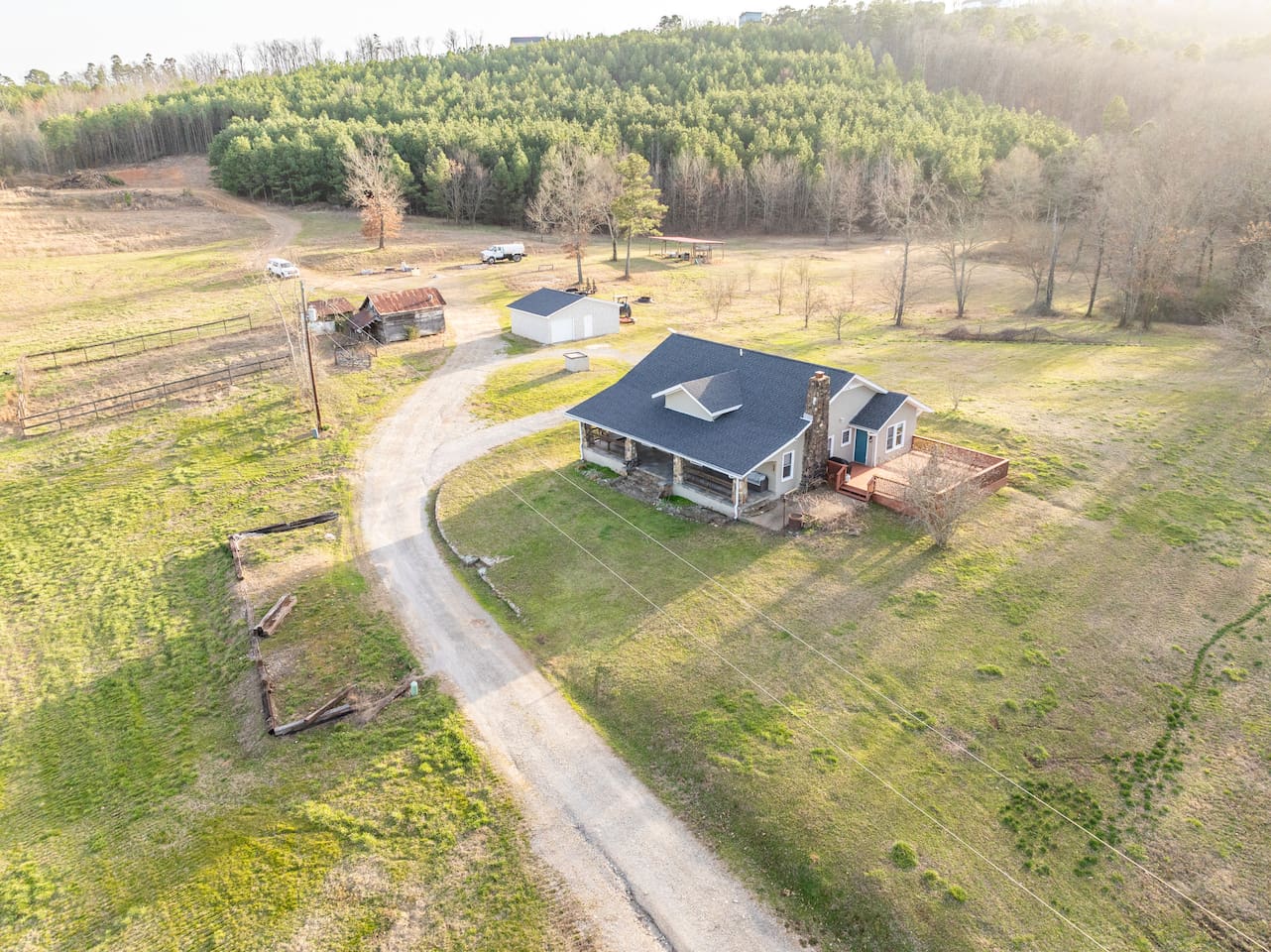 Charming Getaway: Embrace nature from this spacious retreat surrounded by lush woods!