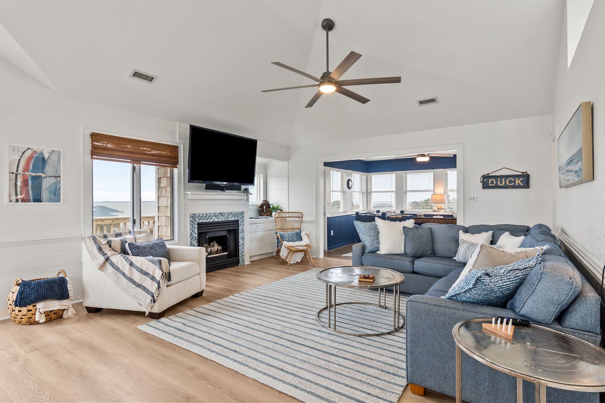 Another look at the living space with bright windows and a cozy feel.