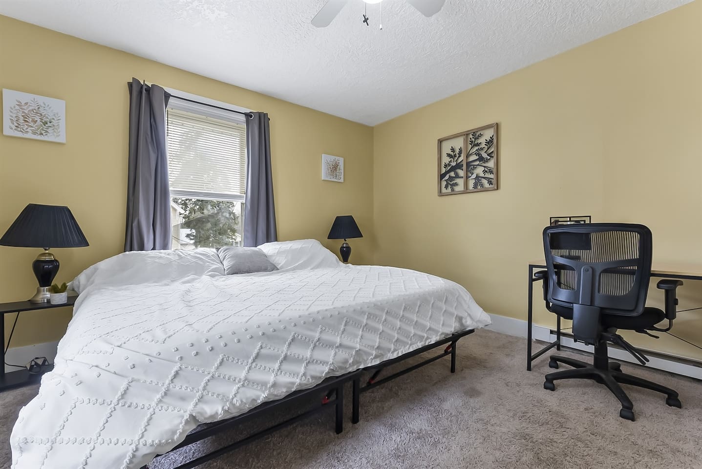 Bedroom with dedicated workspace.