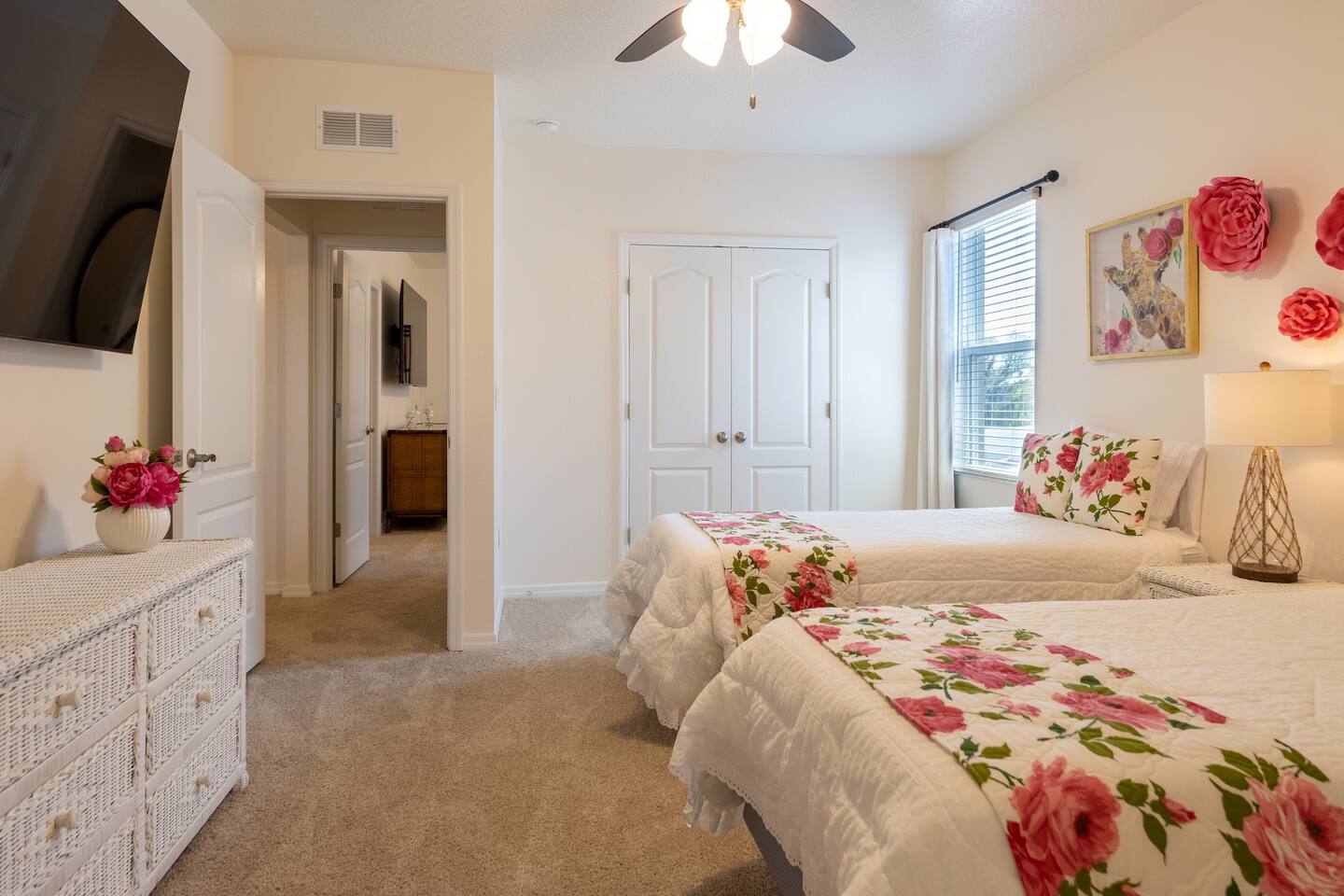 Upstairs Garden Room with two Twin XL Beds and extra comfy memory foam mattresses. Includes a 70 inch smart TV.  Luggage rack & laundry basket in closet.
