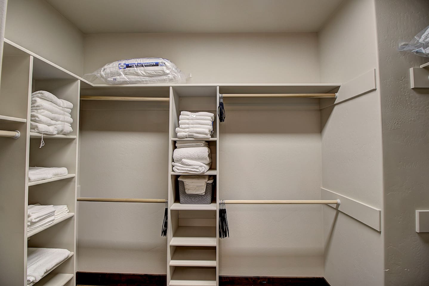 Spacious walk-in closet with ample shelving, fresh linens, and plenty of storage to keep your stay organized and comfortable.