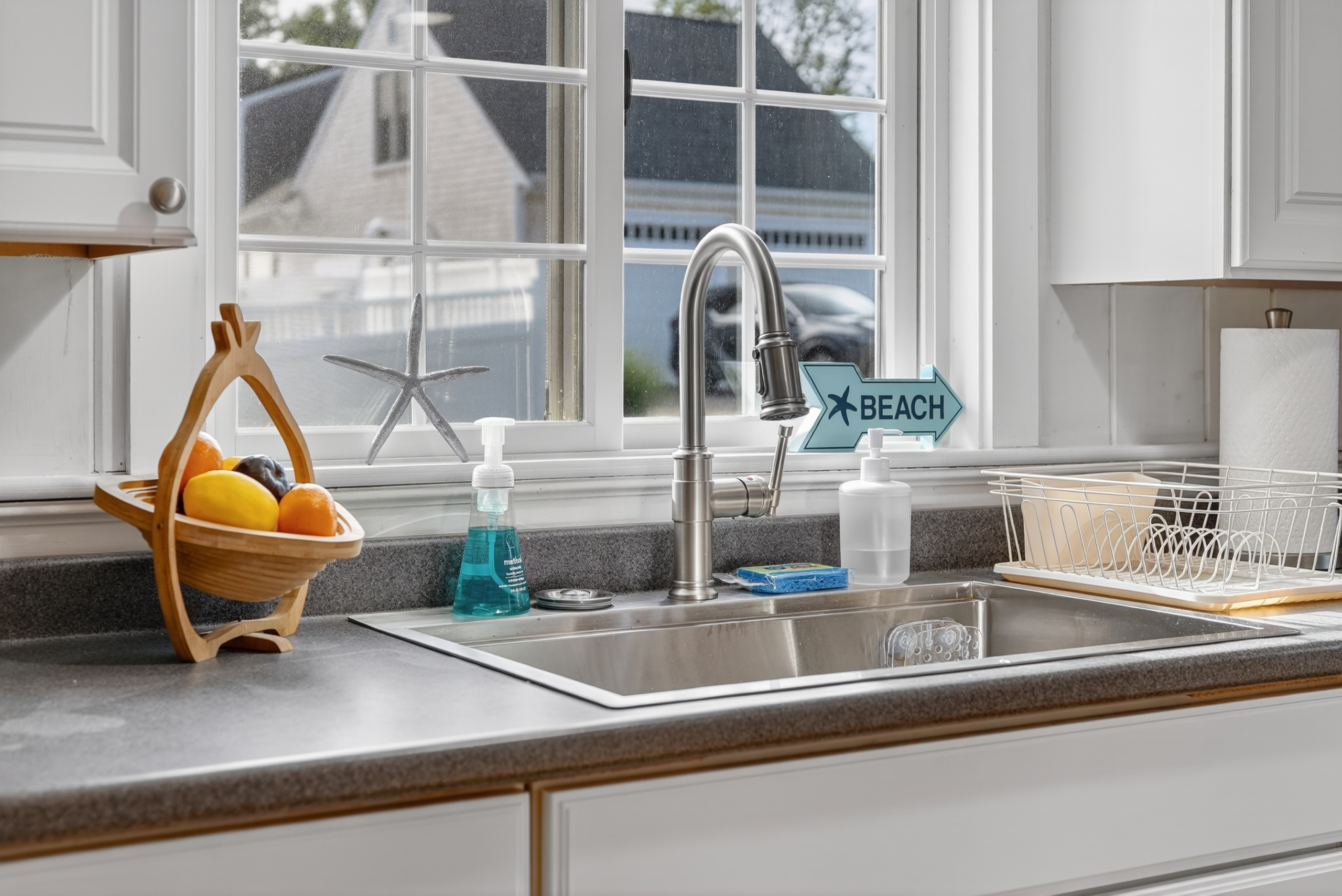 Double-basin sink with a sunny window view, making meal prep and cleanup easy and enjoyable.