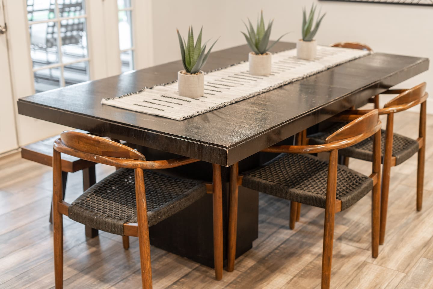 Modern 6-seater dining table, offering ample space for family meals and entertaining.