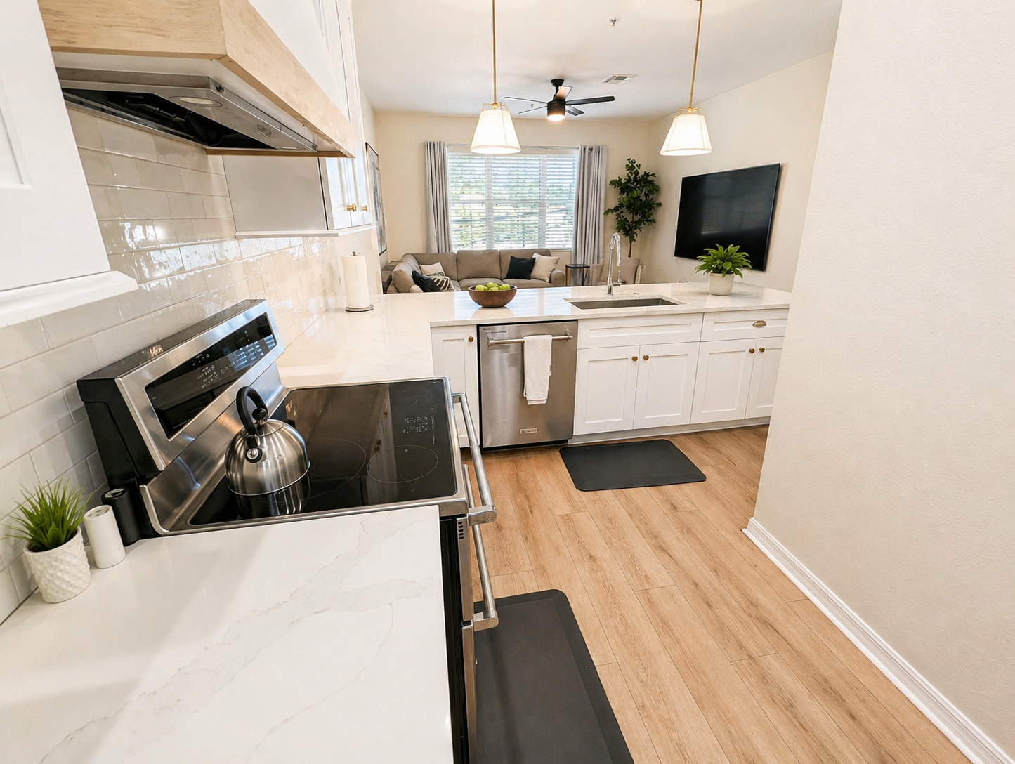 Bright and modern kitchen with sleek countertops, stainless steel appliances, and plenty of prep space. Open layout flows into the living area, making it easy to cook, dine, and stay connected with guests.