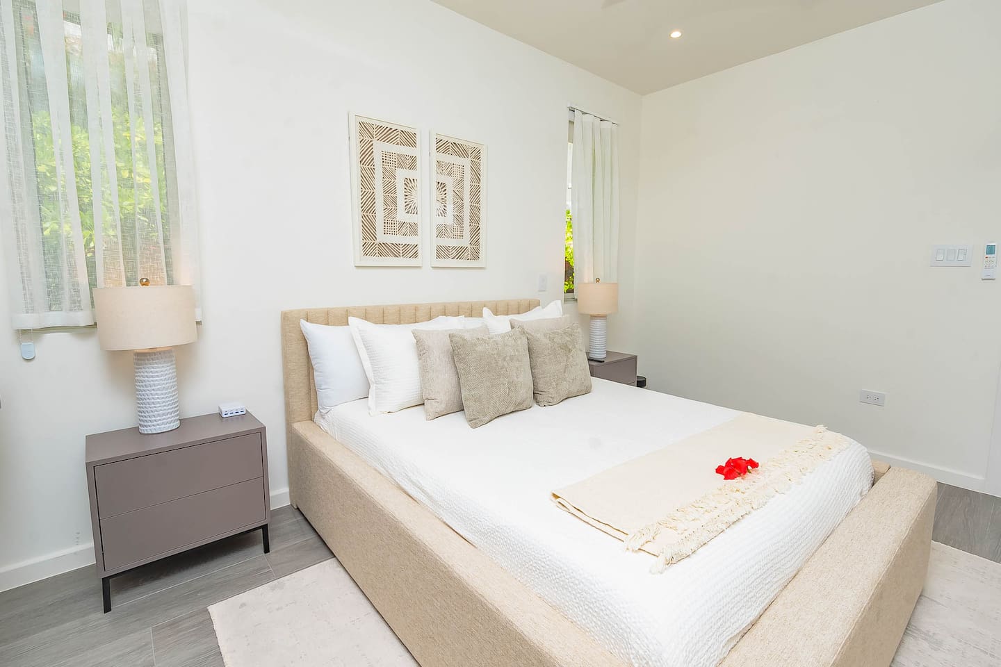 2nd bedroom with queen size bed, air conditioning, ceiling fan, wall mounted TV and closet.