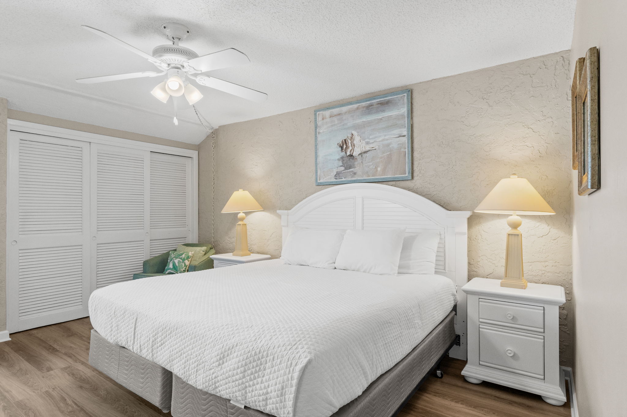 Master Bedroom with King Sized Bed, Ensuite Bathroom, and Balcony Access