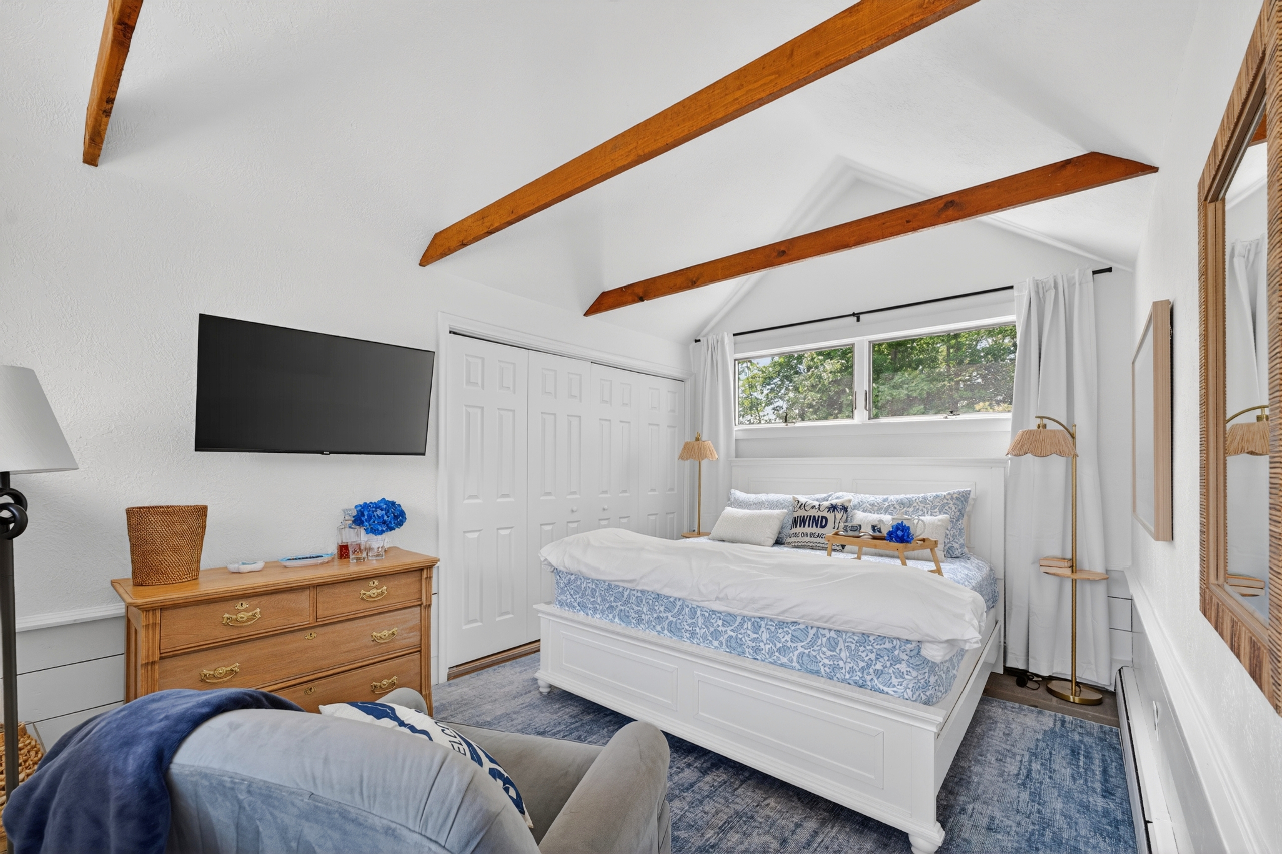 First-floor king suite with private attached bathroom and blackout shades, ideal for stair-free comfort and restful stays.