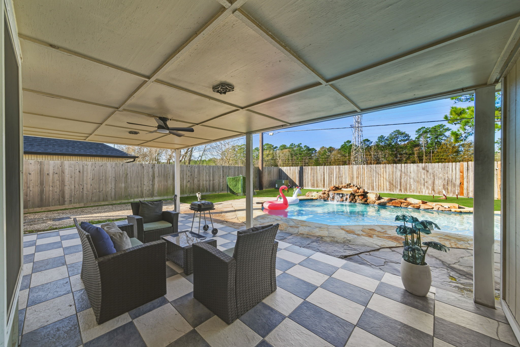 Spacious backyard patio designed for gathering and conversation.