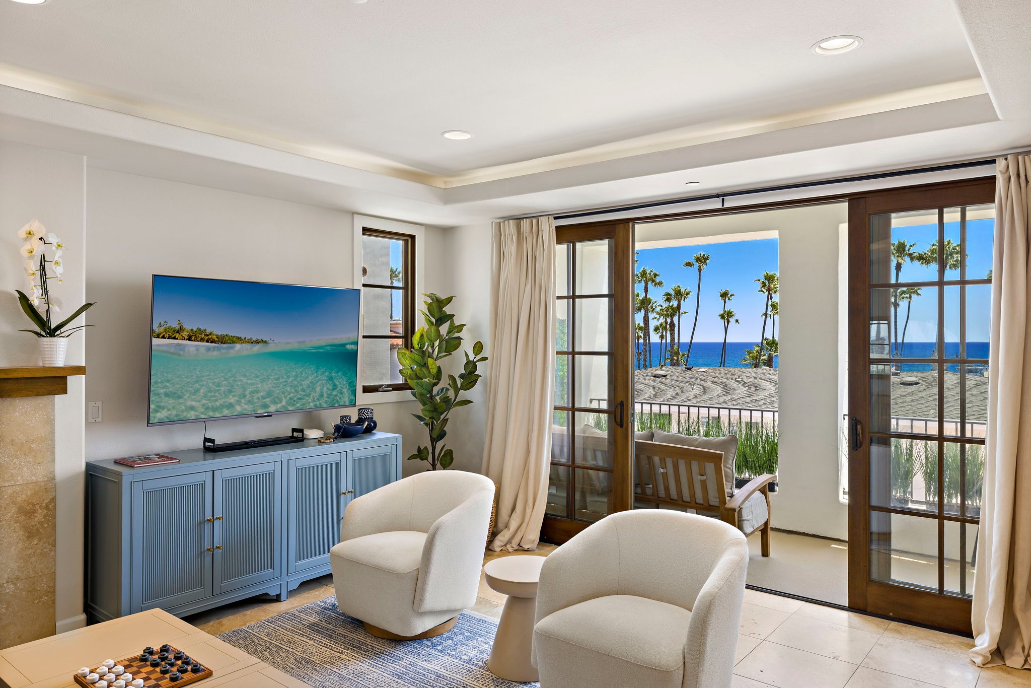 The best of both worlds - this condo is steps from the San Clemente main beach and short walk (or trolley ride) to the village.  The living room has lots of comfortable seating, views and natural light pouring in from the balcony.