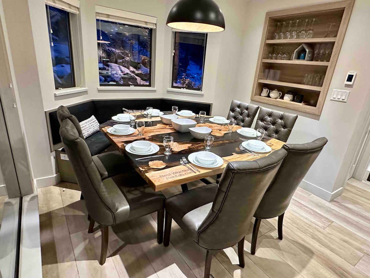 Custom designed live edge maple dining table with build in bench optimizes seating for upto 10 people. Wine glasses, dinnerware for 10ppl.  Patio access from dining area.  Whistler Upper Village a short 2min stroll. Walk to everything, ski-on/ski off