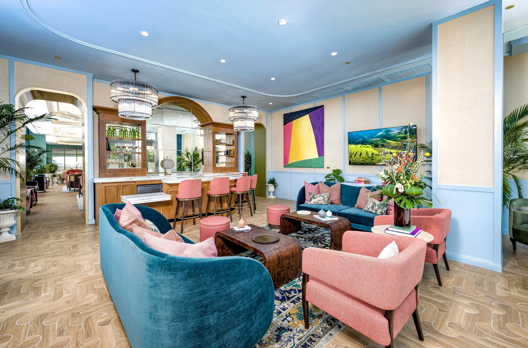 The Lounge — designer chandeliers, velvet armchairs and library bar service