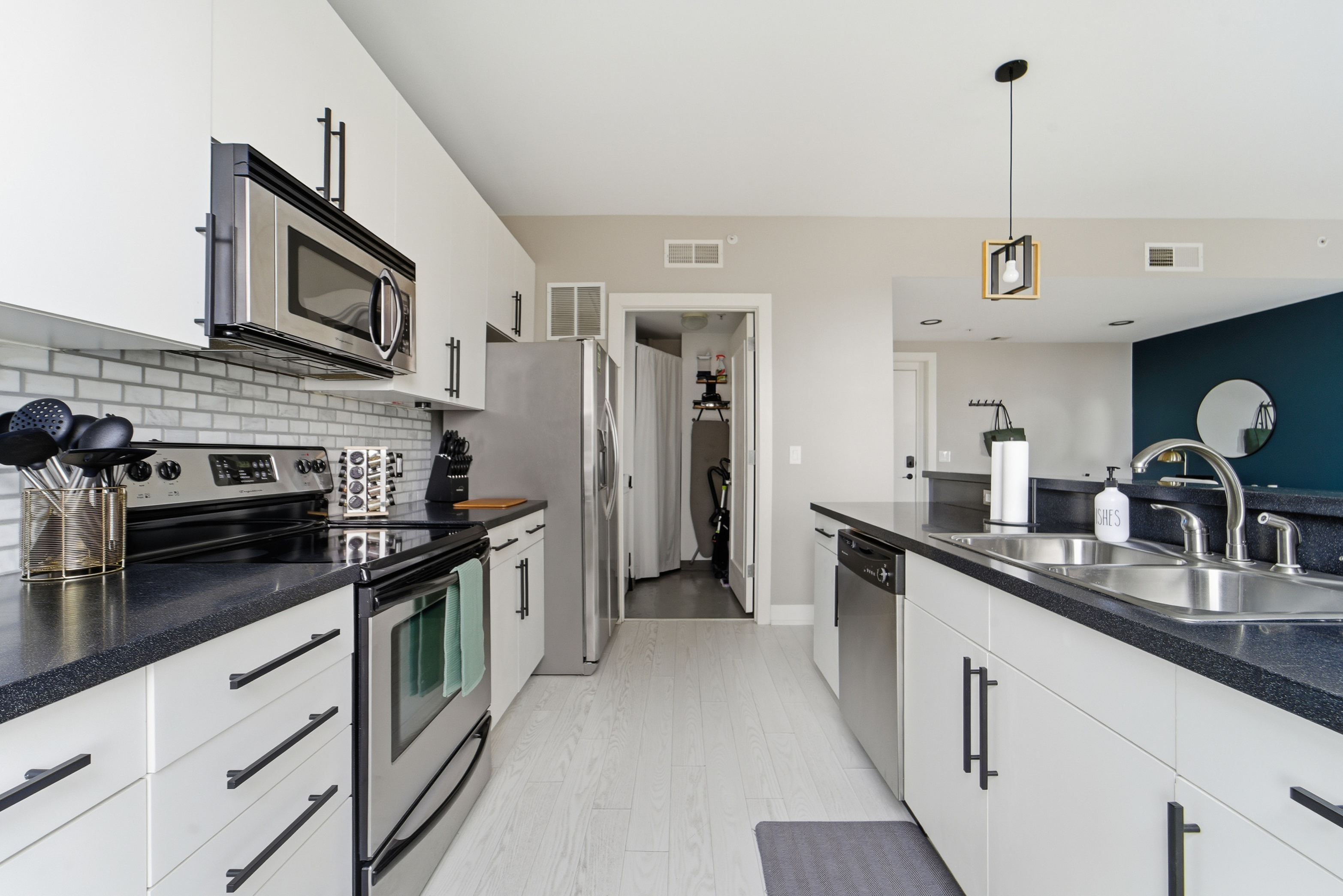 The kitchen is fully stocked with nonstick-nontoxic posts and pans, sharp knives, functional cutting boards, mixing bowls, elegant dishes, cocktail glasses, and a 2-in-1 coffee espresso maker.