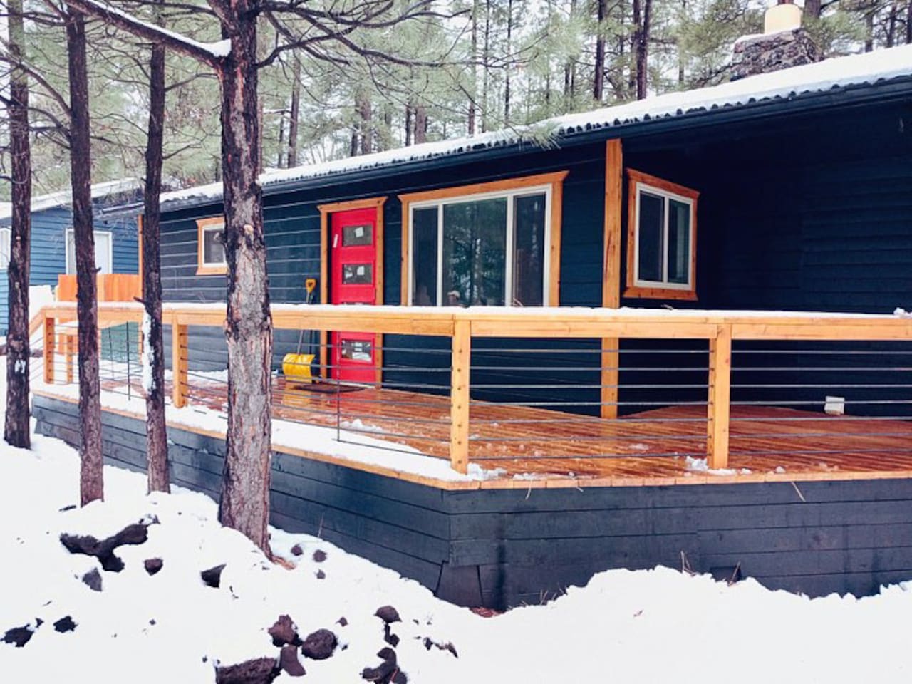 Mid-century modern bungalow with huge porches front and back.