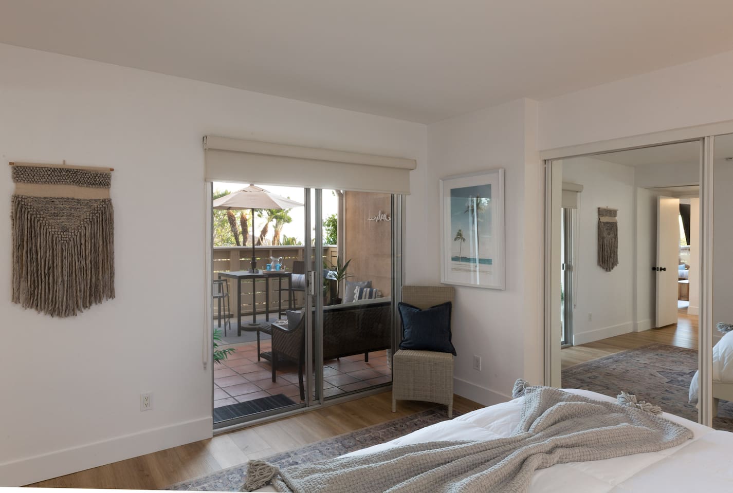 Enjoy the ocean breeze from the patio sliders in this master bedroom 