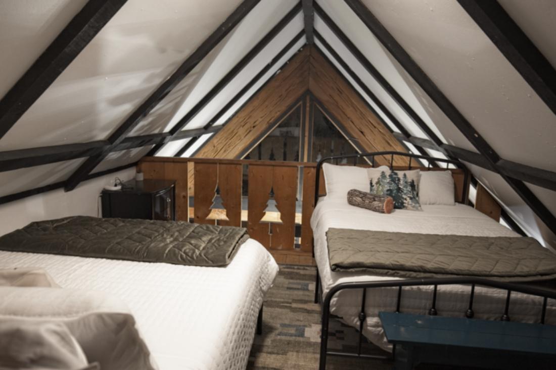 Tuck into your loft hideaway with two full-size Casper beds, cozy blankets, and A-frame charm—perfect for dreamy nights above it all.
