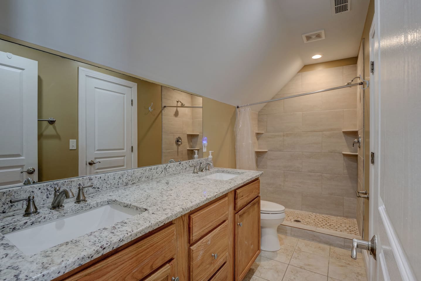 This bathroom is on the top level and shared between Bedrooms 4 & 5