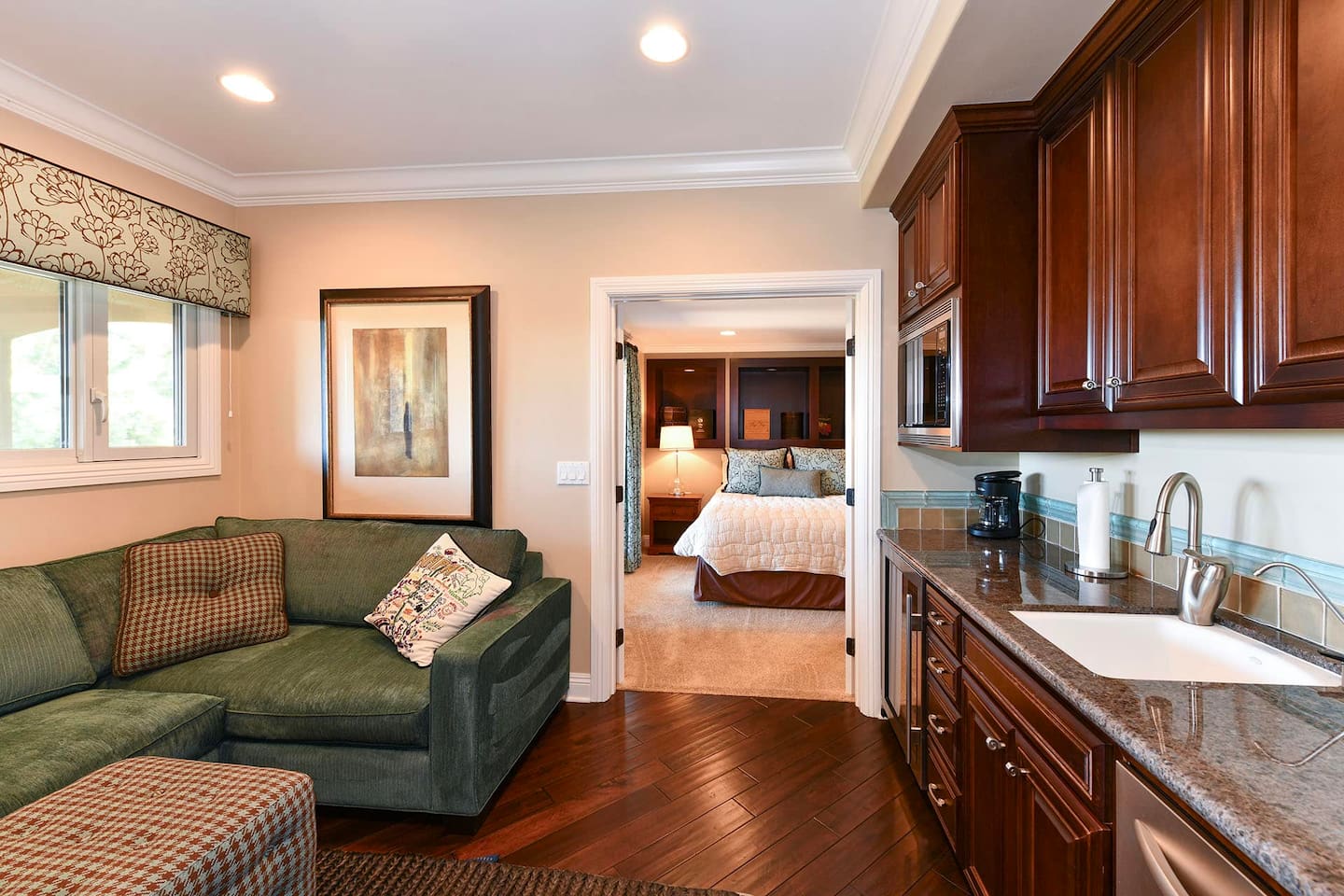 Bedroom suite 4 with living area, kitchenette, queen bed and full bathroom.