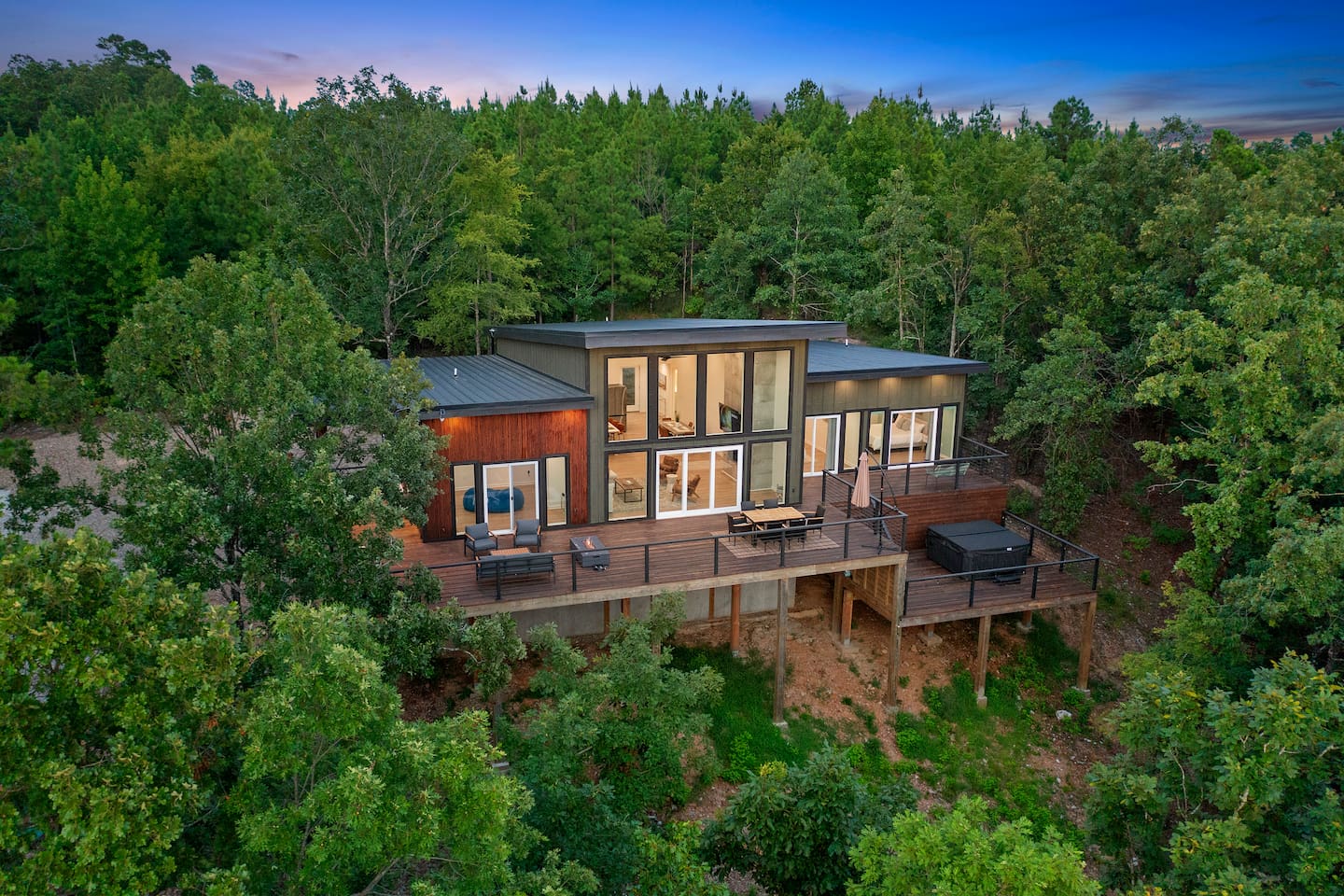 Treehaus in Broken Bow: a modern forest cabin with expansive decks and treetop views.