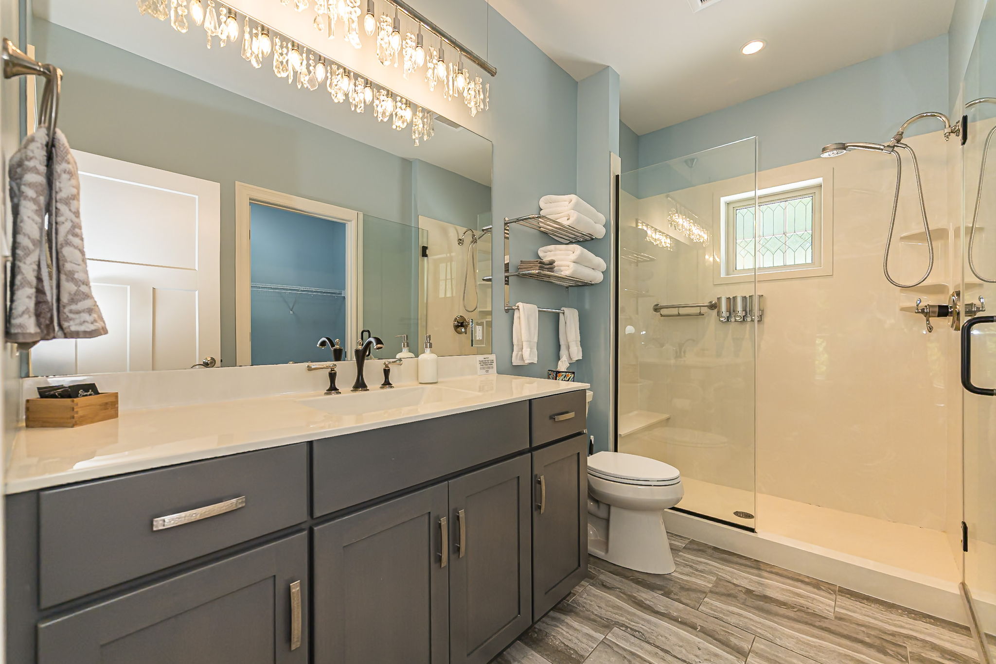 Second full bathroom with vanity and walk-in shower.