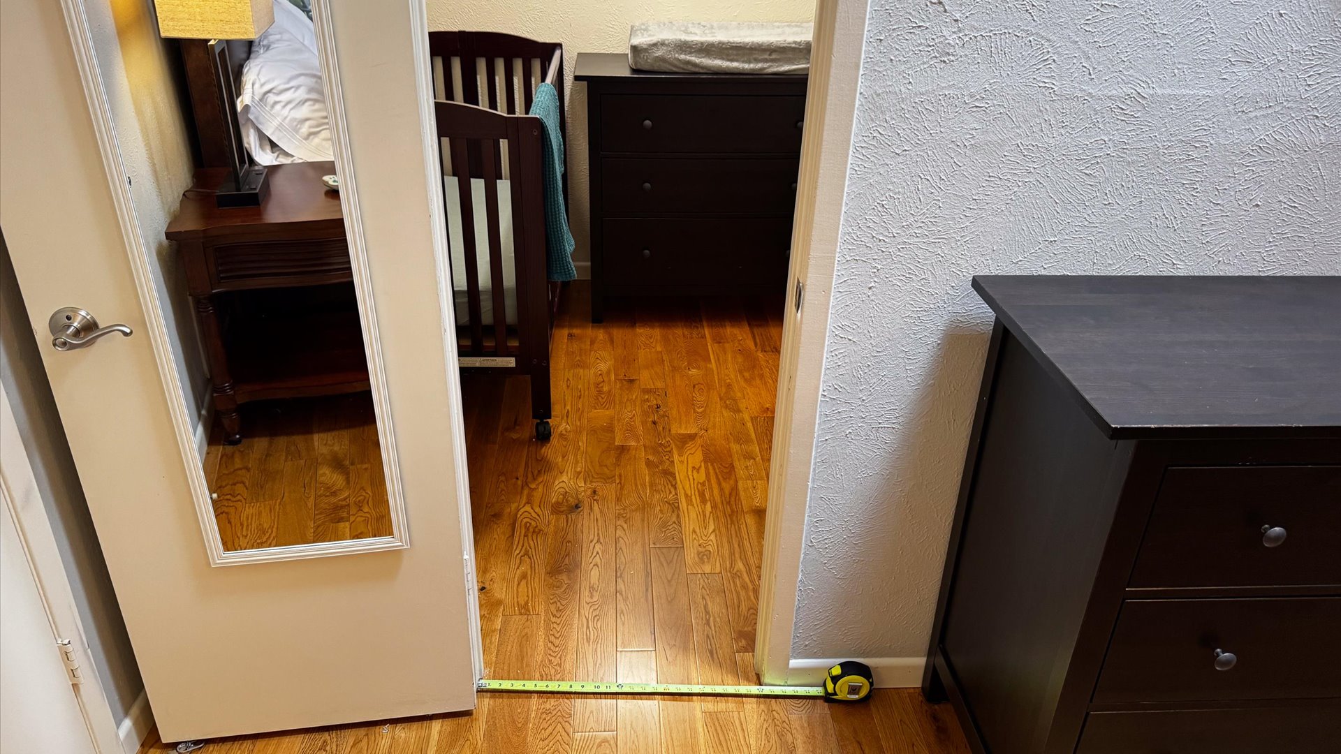 King 2 Suite looking into the baby room with baby essentials.