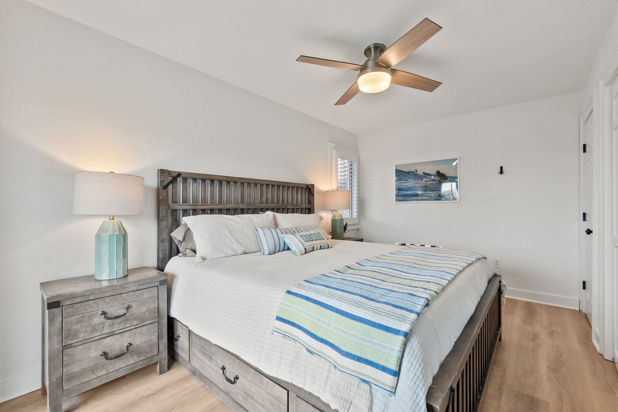 Queen bedroom with a cozy setup and soft coastal touches.