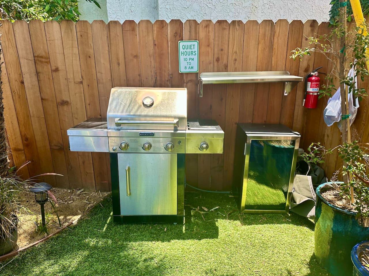 The back yard also has a grill, drink fridge and TV.
