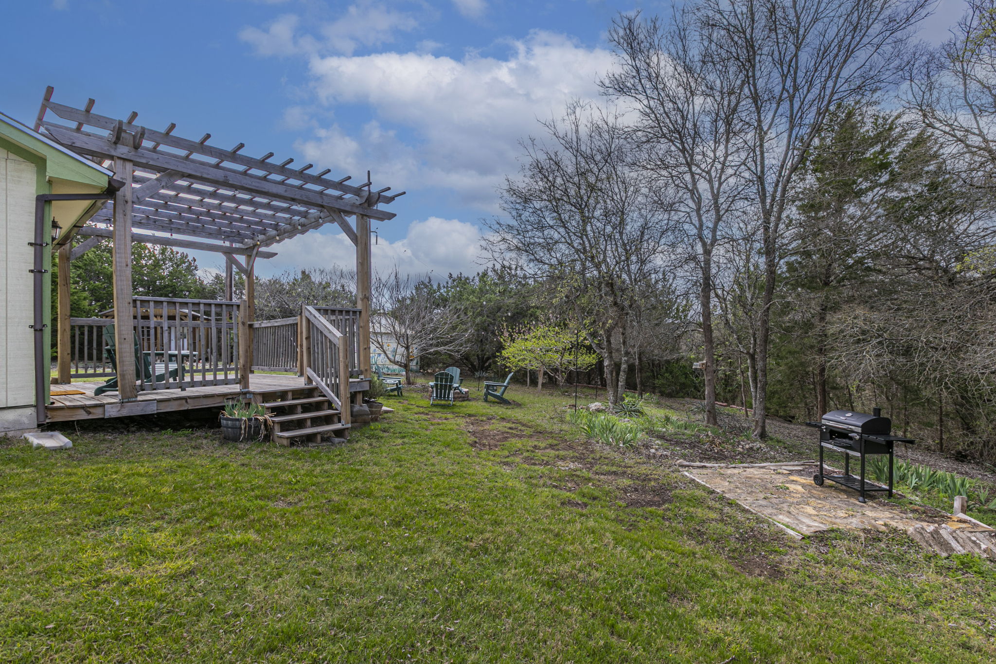 Charcoal grill and peaceful back deck.